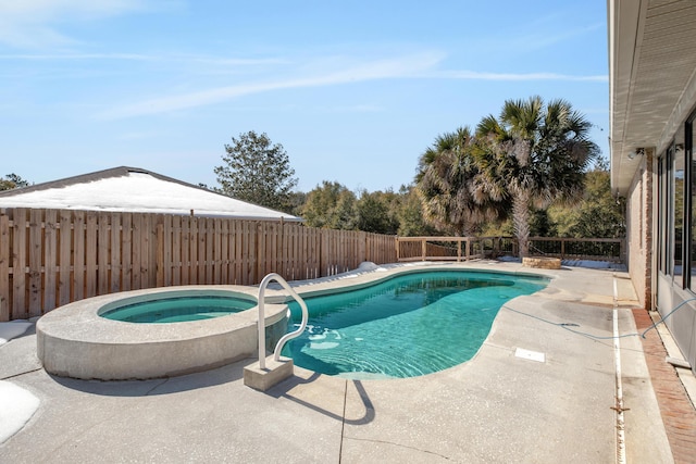 view of pool featuring an in ground hot tub