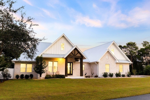 modern farmhouse with a yard