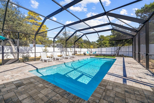 view of pool featuring a lanai and a patio