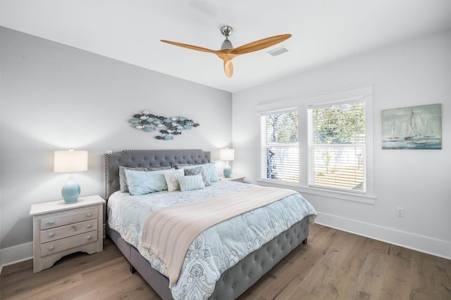 bedroom with ceiling fan and hardwood / wood-style floors