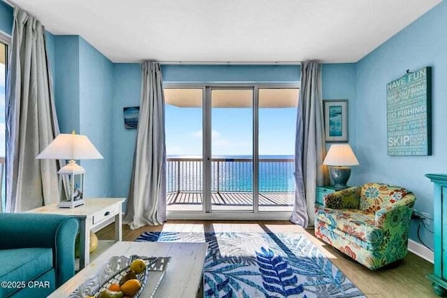 14825 Front Beach Rd Unit 2001, Panama City Beach, FL 32413 - living area featuring a wealth of natural light, a water view, and hardwood / wood-style flooring