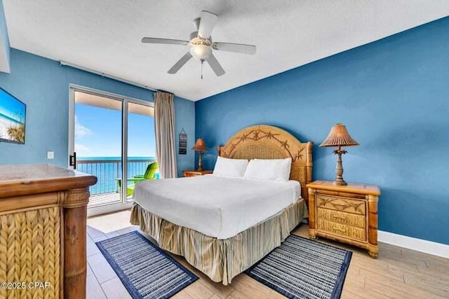 14825 Front Beach Rd Unit 2001, Panama City Beach, FL 32413 - bedroom featuring a textured ceiling, access to exterior, a water view, light wood-type flooring, and ceiling fan