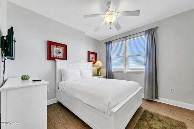 14825 Front Beach Rd Unit 2001, Panama City Beach, FL 32413 - bedroom with ceiling fan and dark hardwood / wood-style floors
