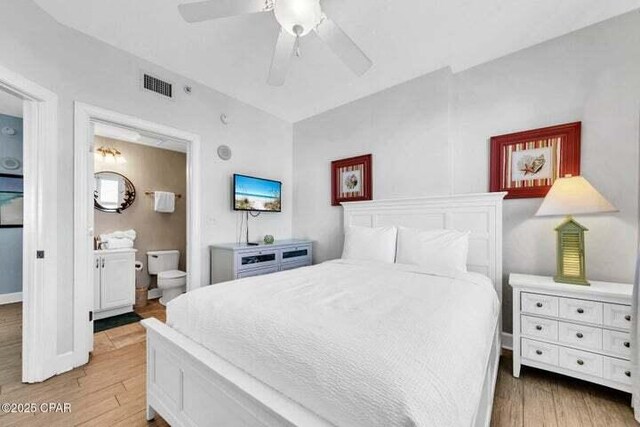 14825 Front Beach Rd Unit 2001, Panama City Beach, FL 32413 - bedroom featuring ceiling fan, connected bathroom, and hardwood / wood-style floors