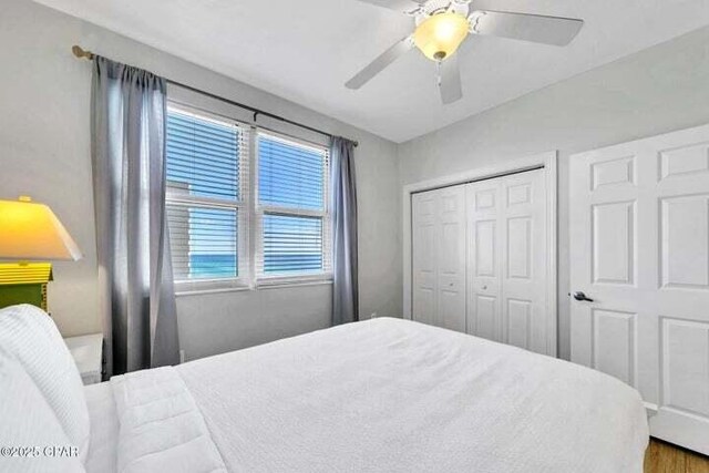 14825 Front Beach Rd Unit 2001, Panama City Beach, FL 32413 - bedroom featuring ceiling fan, a closet, hardwood / wood-style flooring, and multiple windows