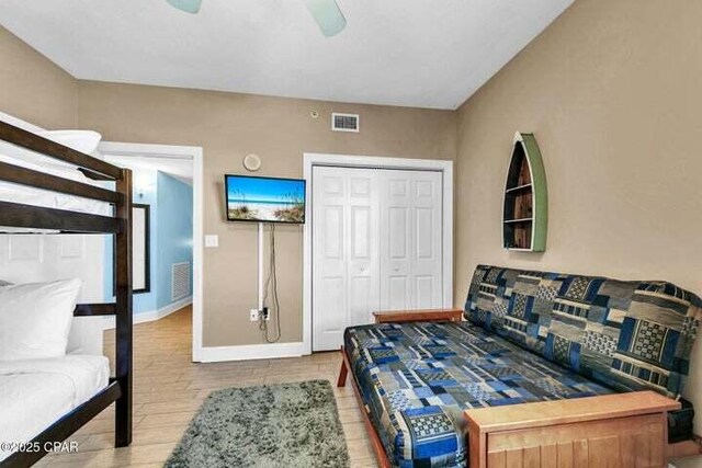 14825 Front Beach Rd Unit 2001, Panama City Beach, FL 32413 - bedroom with ceiling fan, a closet, and light hardwood / wood-style flooring