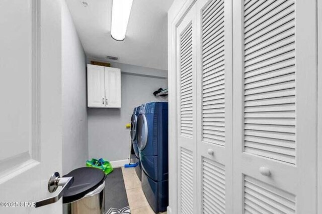 14825 Front Beach Rd Unit 2001, Panama City Beach, FL 32413 - laundry room with cabinets and washer and clothes dryer