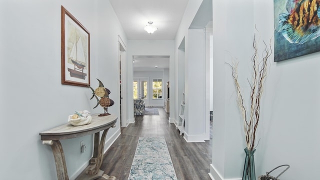 corridor featuring dark wood-type flooring