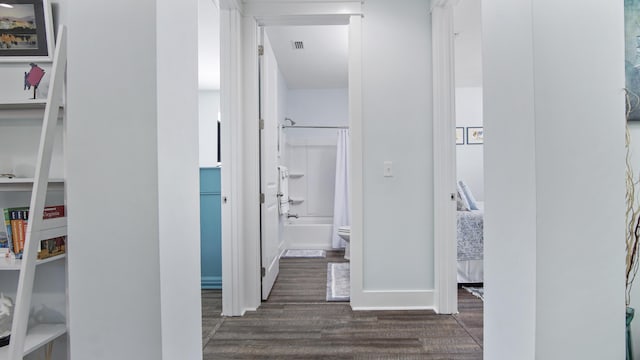 hall with dark hardwood / wood-style flooring