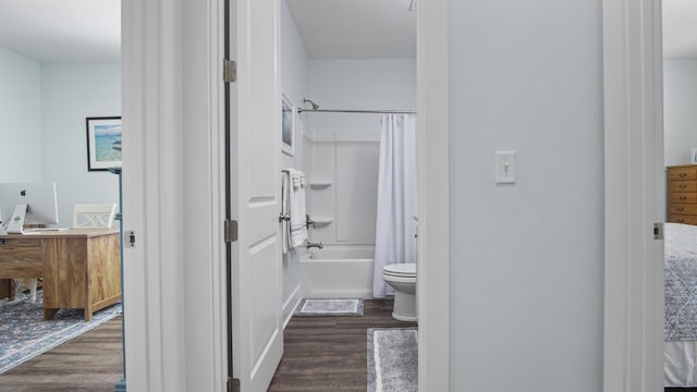 full bathroom with toilet, hardwood / wood-style floors, vanity, and shower / bath combo with shower curtain