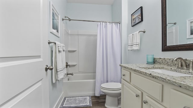 full bathroom with vanity, wood-type flooring, shower / tub combo, and toilet