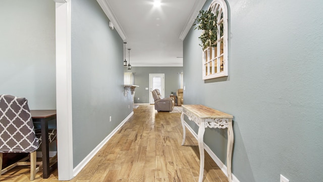 corridor with crown molding and light wood-type flooring