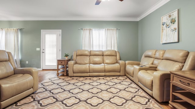 living room with crown molding, ceiling fan, and light hardwood / wood-style floors