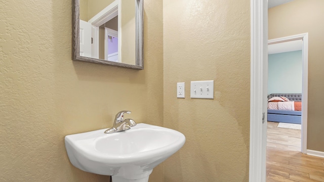 bathroom featuring sink and hardwood / wood-style flooring