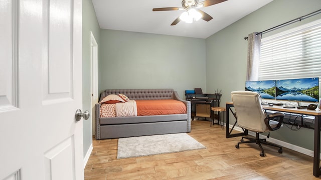 bedroom featuring ceiling fan and light hardwood / wood-style flooring