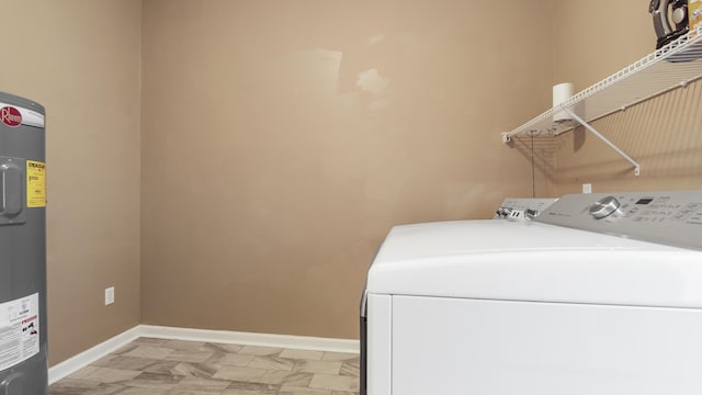 laundry area with washer and clothes dryer and water heater