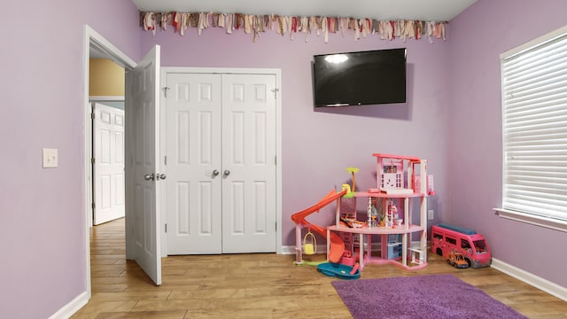 playroom with hardwood / wood-style floors