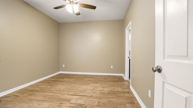 empty room with ceiling fan and light wood-type flooring