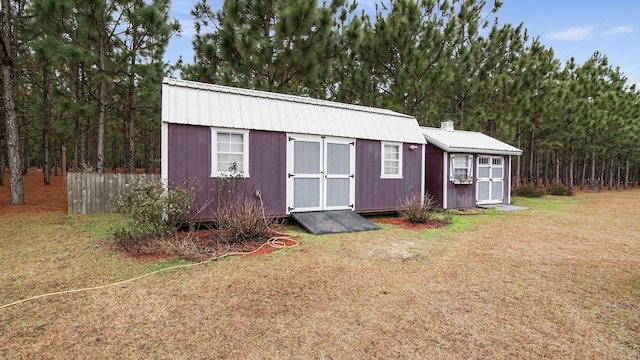 view of outdoor structure with a lawn