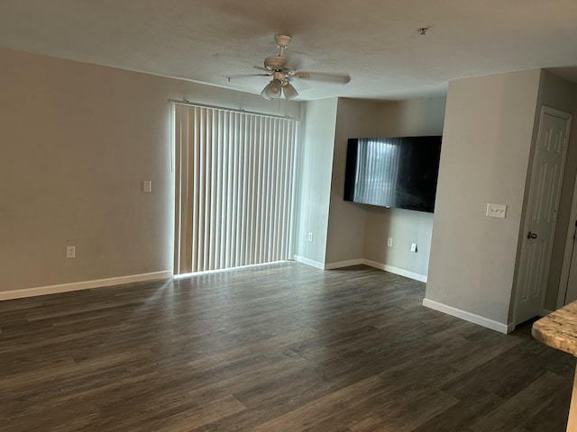 unfurnished living room with ceiling fan and dark hardwood / wood-style flooring