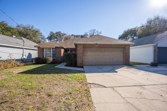 single story home with a garage, brick siding, a shingled roof, concrete driveway, and a front yard