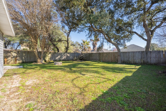 view of yard with a fenced backyard