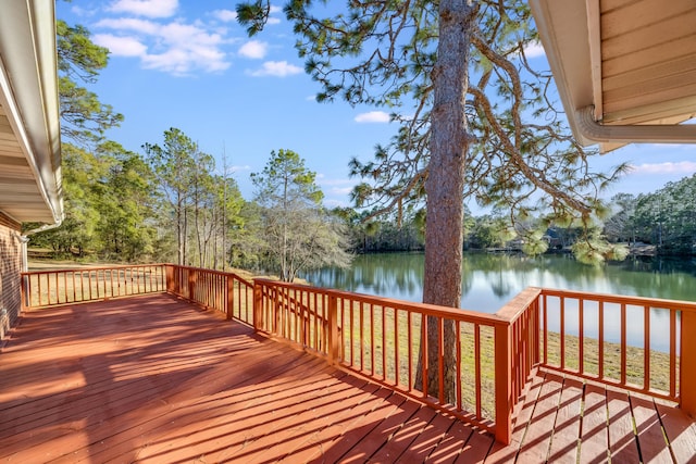 wooden deck featuring a water view