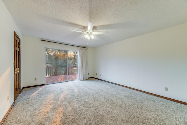 unfurnished room with a textured ceiling, ceiling fan, and carpet flooring