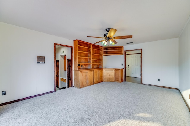 unfurnished bedroom featuring light carpet and ceiling fan