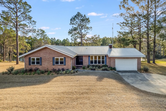 ranch-style house with a front yard and a garage