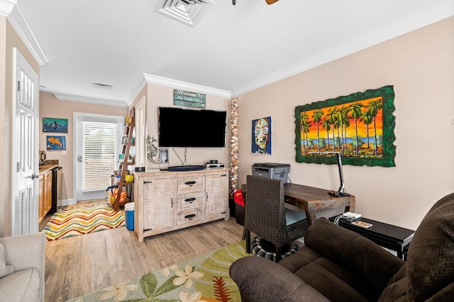 living room with crown molding and light hardwood / wood-style floors