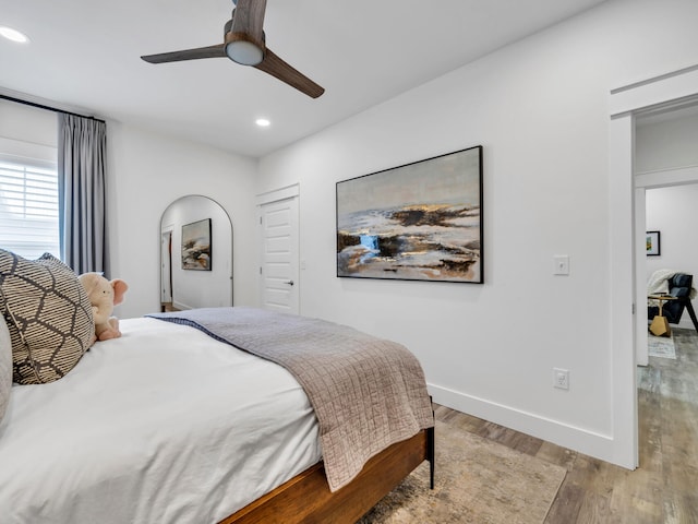 bedroom featuring light hardwood / wood-style flooring and ceiling fan