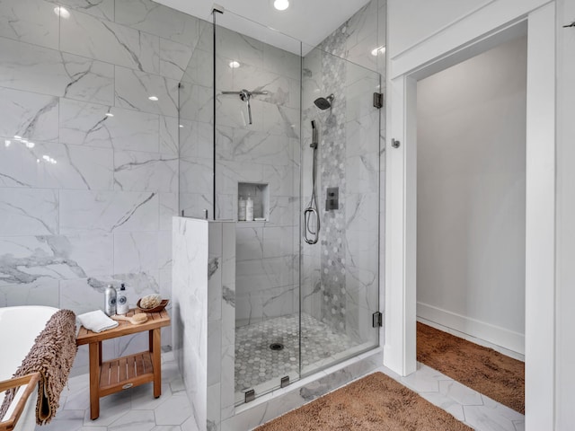 bathroom featuring a shower with shower door