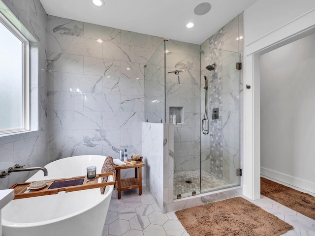 bathroom with plus walk in shower and tile walls