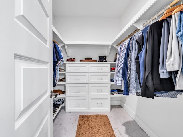 walk in closet featuring light tile patterned floors