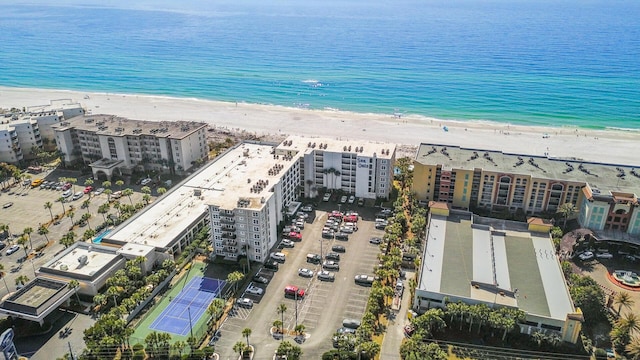 aerial view with a water view and a view of the beach