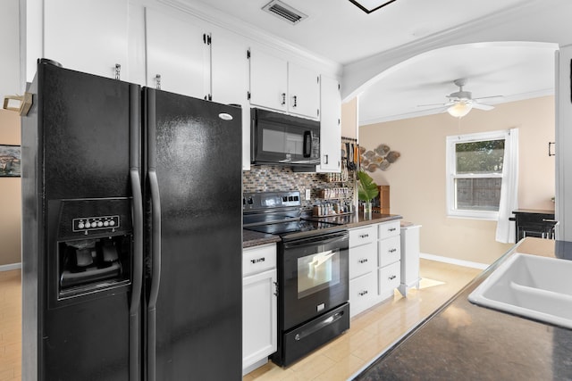 kitchen with sink, ceiling fan, tasteful backsplash, black appliances, and white cabinets