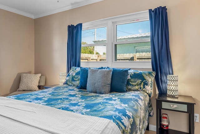 bedroom featuring crown molding