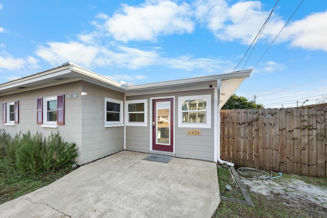 property entrance with a patio