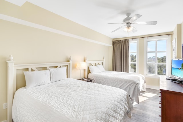 bedroom featuring light hardwood / wood-style flooring and ceiling fan