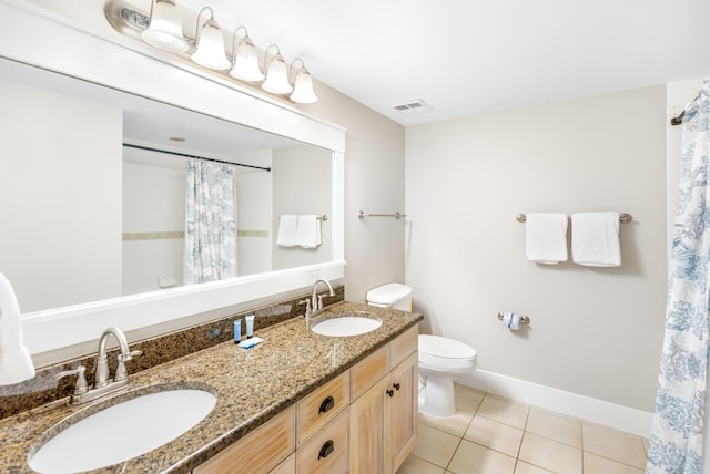 bathroom with vanity, toilet, tile patterned floors, and a shower with curtain