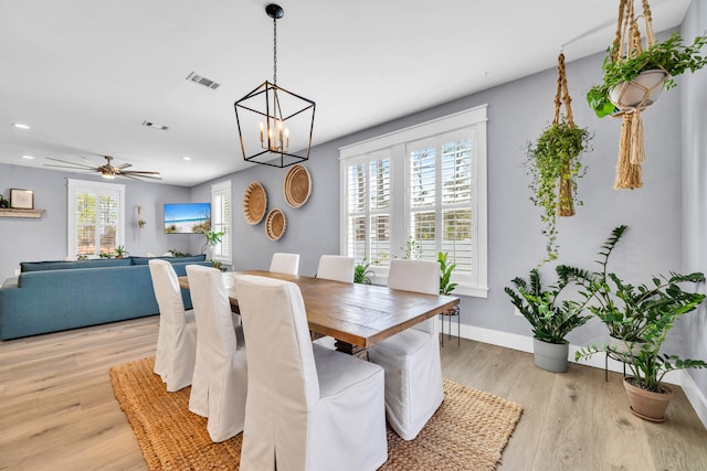 dining space featuring ceiling fan and light hardwood / wood-style flooring