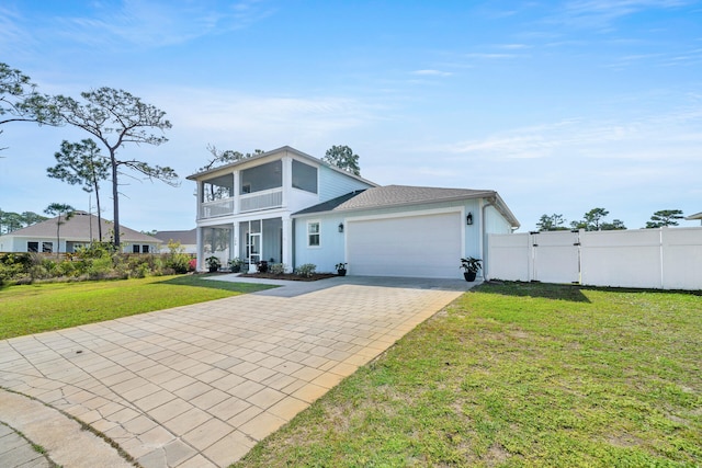 view of front facade featuring a front yard and a garage