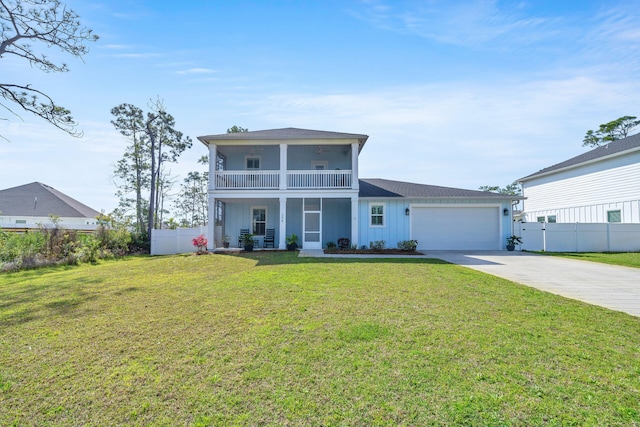 view of front of house featuring a garage, a front lawn, and a balcony