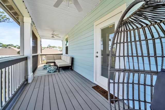 deck with ceiling fan and a porch