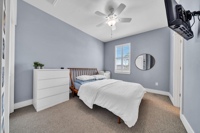 bedroom featuring light colored carpet and ceiling fan