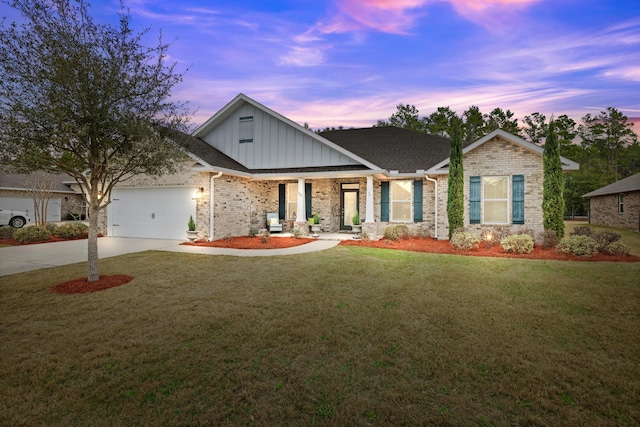 craftsman house featuring a garage and a yard