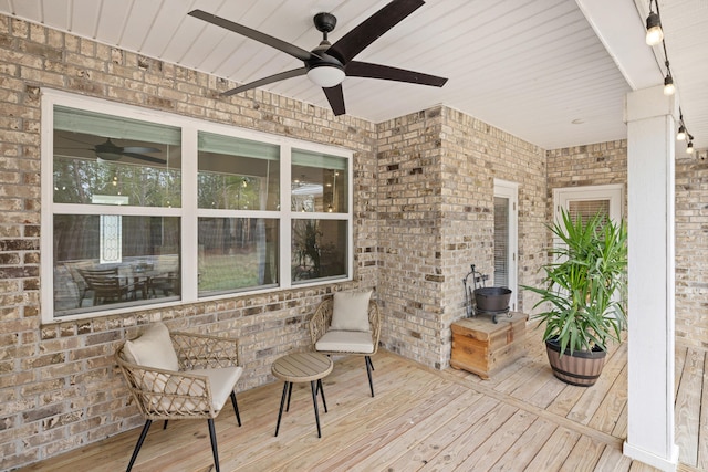 wooden terrace featuring ceiling fan