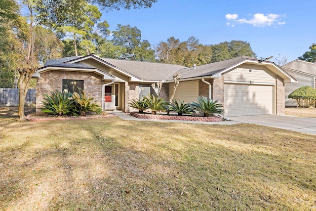 ranch-style house featuring a garage and a front lawn