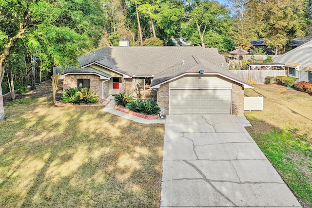 view of front facade featuring a garage and a front lawn